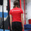 Youth circus student faces away from the camera showing the back of her AirCraft Circus Academy tshirt