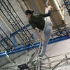 Aerial rope student in a straddle position on the rope