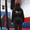 Circus student stands facing away from the camera, showing the back of her AirCraft Circus Academy hoody