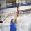 Trapeze student standing underneath the bar
