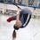 Trapeze student holding a pike position under the bar